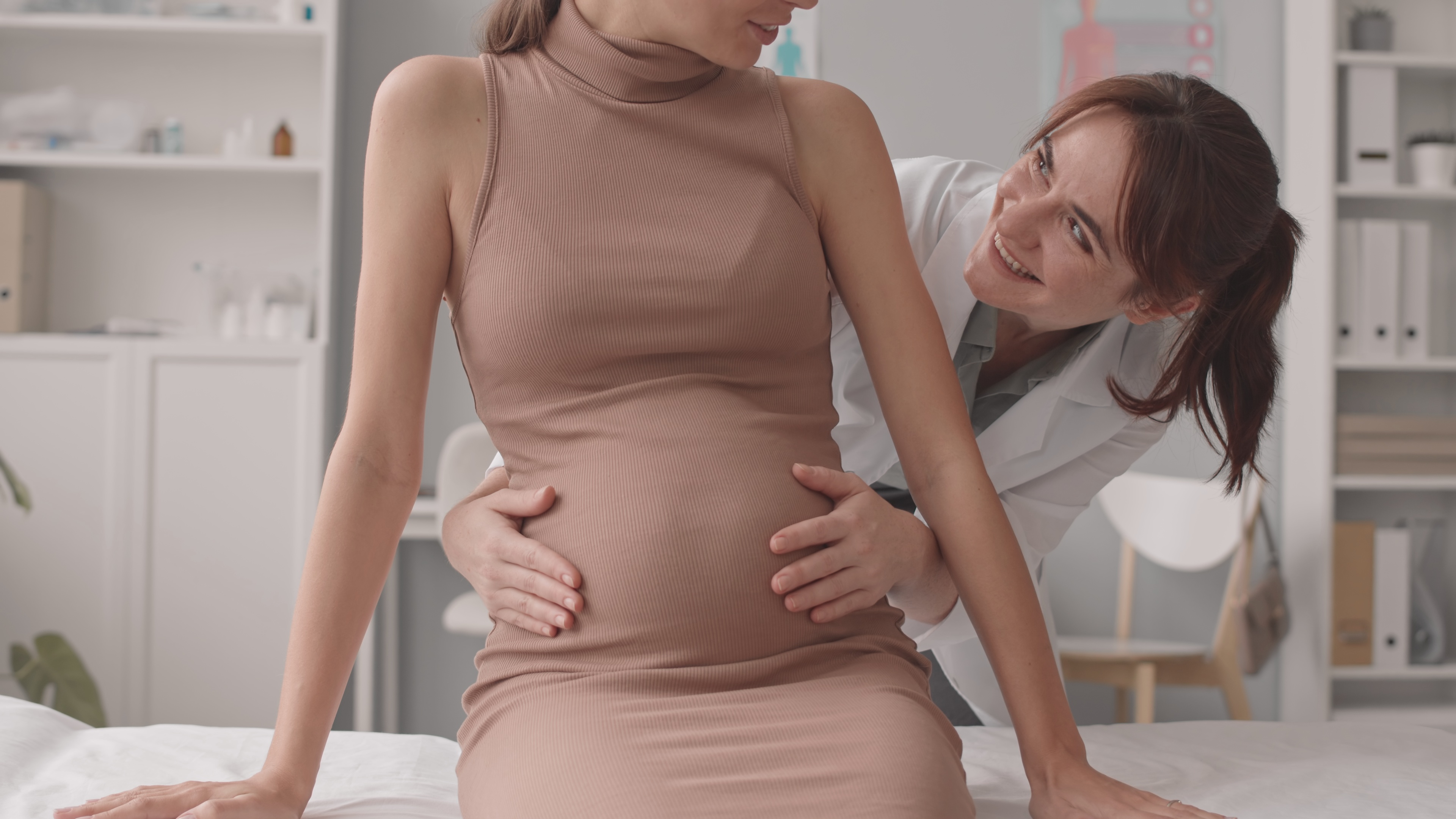 Doctor examining pregnant woman
